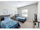 Inviting bedroom with twin beds, soft carpet, and a serene decor at 185 Brookes Pl, Haines City, FL 33844