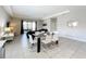 Bright dining area with a glass-top table, seating for six, and patio access at 185 Brookes Pl, Haines City, FL 33844