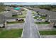 Aerial view of property and community featuring well-maintained lawns and mature trees at 2724 Shelby Ruth Pl, Saint Cloud, FL 34769