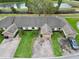 Aerial view of the homes featuring lush green lawns, landscaping and water view at 2724 Shelby Ruth Pl, Saint Cloud, FL 34769