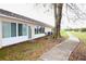 Backyard featuring a sidewalk, trees, and back of home at 2724 Shelby Ruth Pl, Saint Cloud, FL 34769