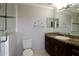 Bathroom with glass enclosed shower and dark wood vanity and neutral countertop at 2724 Shelby Ruth Pl, Saint Cloud, FL 34769