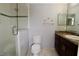 Bathroom with marble-patterned tile flooring and glass enclosed shower at 2724 Shelby Ruth Pl, Saint Cloud, FL 34769