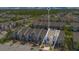 Aerial view of townhomes with lush landscaping and parking at 2106 Chatham Place Dr, Orlando, FL 32824
