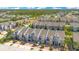 Aerial view of new construction townhomes with beautiful landscaping and paver driveways at 2106 Chatham Place Dr, Orlando, FL 32824