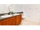 Well-lit bathroom with double vanity, tile flooring, and a toilet at 2106 Chatham Place Dr, Orlando, FL 32824