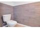 Bathroom featuring wood-look tile and standard toilet at 2106 Chatham Place Dr, Orlando, FL 32824