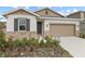 Newly built home with stone accents and a two-car garage at 3345 Chicory Ct, Lake Hamilton, FL 33851