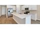 Modern kitchen with stainless steel appliances and an island at 3345 Chicory Ct, Lake Hamilton, FL 33851