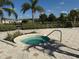 Inviting hot tub surrounded by lush landscaping and palm trees in a community recreation area at 4980 W Castle W St, Kissimmee, FL 34758