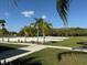 Sand volleyball court with palm trees, nestled within a recreational area with lush landscaping at 4980 W Castle W St, Kissimmee, FL 34758