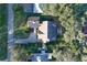 Aerial view of home with solar panels, a long driveway, and well-maintained landscaping at 19529 Dorr Rd, Altoona, FL 32702