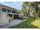 Spacious backyard with a fire pit area and stairs leading to a second story porch at 19529 Dorr Rd, Altoona, FL 32702
