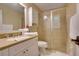 Bathroom featuring enclosed glass shower, granite vanity countertop, and white cabinetry at 19529 Dorr Rd, Altoona, FL 32702