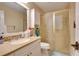 Bathroom with vanity, granite countertop, and glass enclosed shower at 19529 Dorr Rd, Altoona, FL 32702