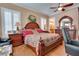 Comfortable bedroom with warm tones, plantation shutters, and ample space, creating a relaxing and inviting atmosphere at 19529 Dorr Rd, Altoona, FL 32702