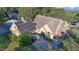 Inviting home exterior with solar panels, a spacious driveway, and lush landscaping, perfect for a sustainable lifestyle at 19529 Dorr Rd, Altoona, FL 32702