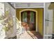 Charming front door with decorative wreaths and a bicycle at 19529 Dorr Rd, Altoona, FL 32702