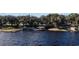 Waterfront property featuring multiple boat docks and mature trees along the shore at 19529 Dorr Rd, Altoona, FL 32702