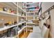 Walk-in pantry with ample shelving and a seating area at 19529 Dorr Rd, Altoona, FL 32702