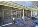 Relaxing screened-in porch featuring comfortable seating, ceiling fans, and serene outdoor views at 19529 Dorr Rd, Altoona, FL 32702