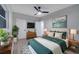 Cozy bedroom with a ceiling fan, hardwood floors, and calming decor at 1318 Terre Cia Ave, Orlando, FL 32807