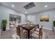Modern dining room featuring a stylish table, seating for six, and a unique ceiling design at 1318 Terre Cia Ave, Orlando, FL 32807