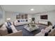 Inviting living room with hardwood floors, comfortable seating, and a bright window view at 1318 Terre Cia Ave, Orlando, FL 32807