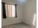 Bright bedroom featuring wood-look floors and natural light at 2647 Surrey Ct # 2647, Kissimmee, FL 34741