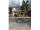 Charming condo featuring lush palm trees and a partially fenced yard with dedicated guest parking at 2647 Surrey Ct # 2647, Kissimmee, FL 34741