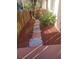 Front walkway adorned with mulch, white gravel, pavers, and lush greenery at 2647 Surrey Ct # 2647, Kissimmee, FL 34741