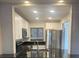 Modern kitchen featuring stainless steel appliances, granite countertops, and ample cabinet space at 2647 Surrey Ct # 2647, Kissimmee, FL 34741