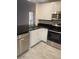 Modern kitchen featuring stainless steel appliances, granite countertops, and neutral decor at 2647 Surrey Ct # 2647, Kissimmee, FL 34741