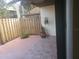 Private patio with wooden fence and tiled flooring, perfect for relaxing outdoors at 2647 Surrey Ct # 2647, Kissimmee, FL 34741