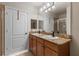 Bathroom featuring double vanity, granite countertop, and a large mirror at 501 Mirasol Cir # 424, Celebration, FL 34747