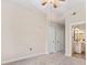 Bedroom features neutral carpet, ceiling fan, and access to bathroom and closet at 501 Mirasol Cir # 424, Celebration, FL 34747