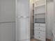 Walk-in closet features custom shelving and ample storage space at 501 Mirasol Cir # 424, Celebration, FL 34747
