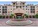 Beautiful building with a fountain and brick entry to welcome you home at 501 Mirasol Cir # 424, Celebration, FL 34747