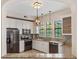 Open kitchen design featuring stainless appliances, granite counters, pendant lighting, and breakfast bar at 501 Mirasol Cir # 424, Celebration, FL 34747