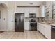 Kitchen features stainless steel appliances, granite counters, and ample storage at 501 Mirasol Cir # 424, Celebration, FL 34747