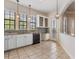 Bright kitchen features white cabinets, granite countertops, stainless appliances, and tiled floor at 501 Mirasol Cir # 424, Celebration, FL 34747