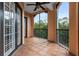 Screened lanai with tiled flooring and a view of surrounding trees at 501 Mirasol Cir # 424, Celebration, FL 34747