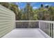 Back porch offering scenic views of the surrounding mature trees under blue skies at 3145 Britannia Blvd # D, Kissimmee, FL 34747