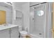 Bright bathroom with a shower featuring white tiling and a unique octagon window at 3145 Britannia Blvd # D, Kissimmee, FL 34747