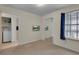 Cozy bedroom featuring a full-length mirror closet and window with coverings at 3145 Britannia Blvd # D, Kissimmee, FL 34747