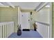 Inviting condo entrance with a well-lit porch and decorative potted plants at 3145 Britannia Blvd # D, Kissimmee, FL 34747