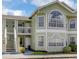 Charming two-story condo featuring multiple windows and well-maintained landscaping at 3145 Britannia Blvd # D, Kissimmee, FL 34747