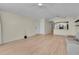 Spacious living room boasts modern flooring and a flowing design into the kitchen area at 3145 Britannia Blvd # D, Kissimmee, FL 34747