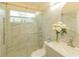 Bright bathroom featuring a glass shower and vanity with stylish decor at 162 Seneca Point Trl, Kissimmee, FL 34746