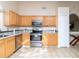 Bright kitchen features stainless steel appliances, granite countertops, and ample cabinet space at 162 Seneca Point Trl, Kissimmee, FL 34746